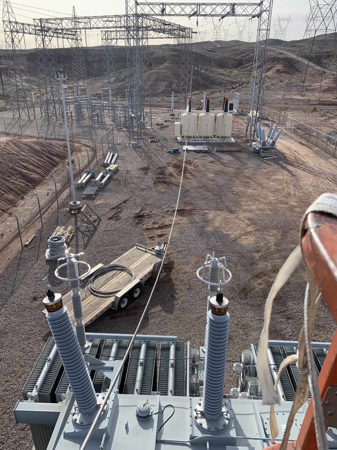Transformer bushings and cooling radiators staged during installation at the Boulder City Tap, Nevada